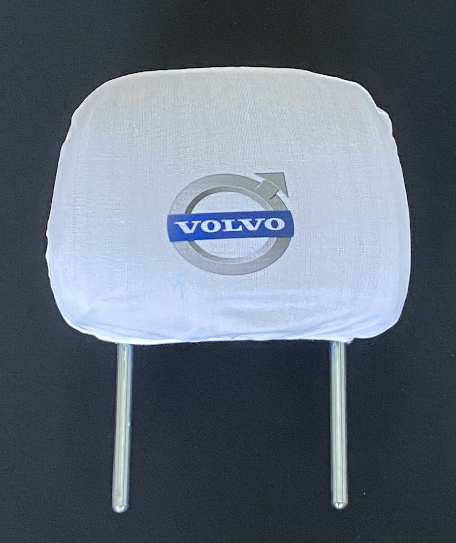 Biele návleky na opierky hlavy s logom Volvo